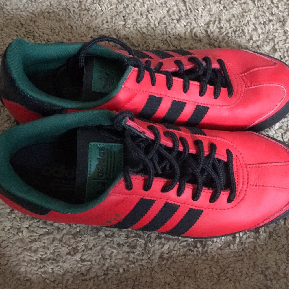 Red, black, and green Adidas originals